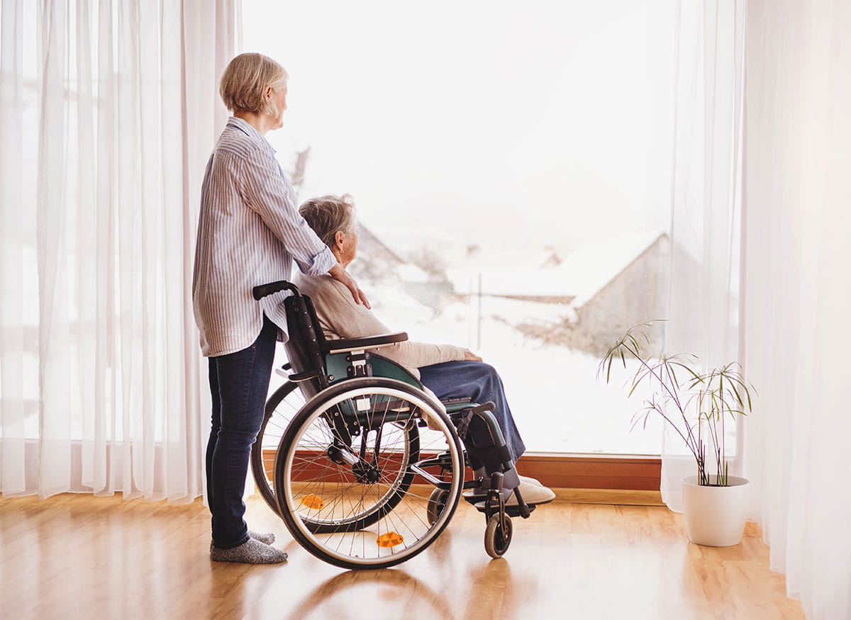 woman with wheelchair at home