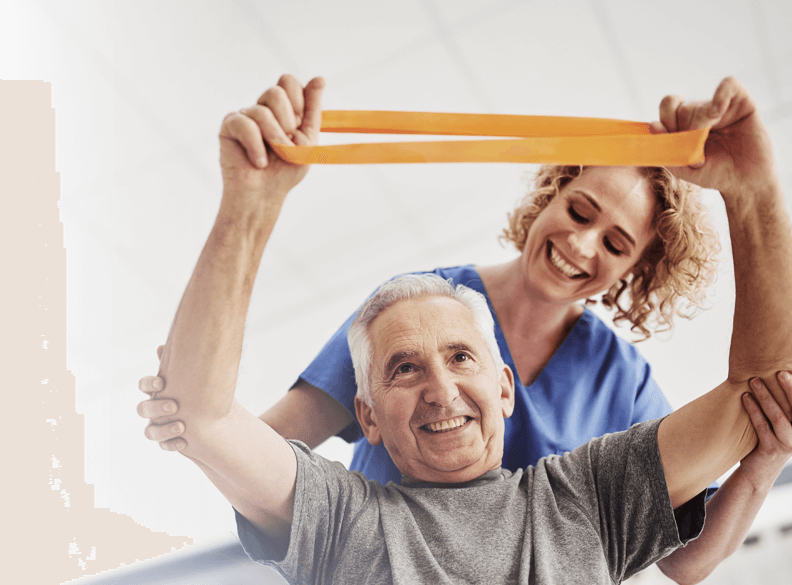 A healthcare worker is helping a rehab patient with resistance bands.